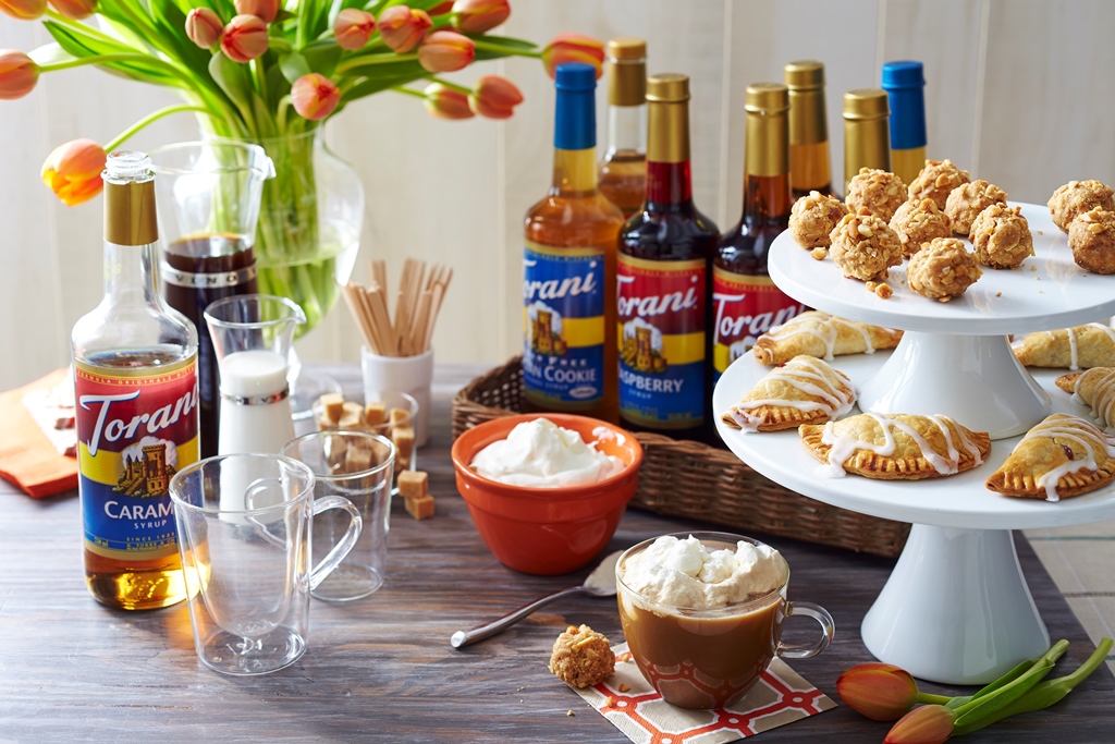 table setting with brunch foods and Torani syrups