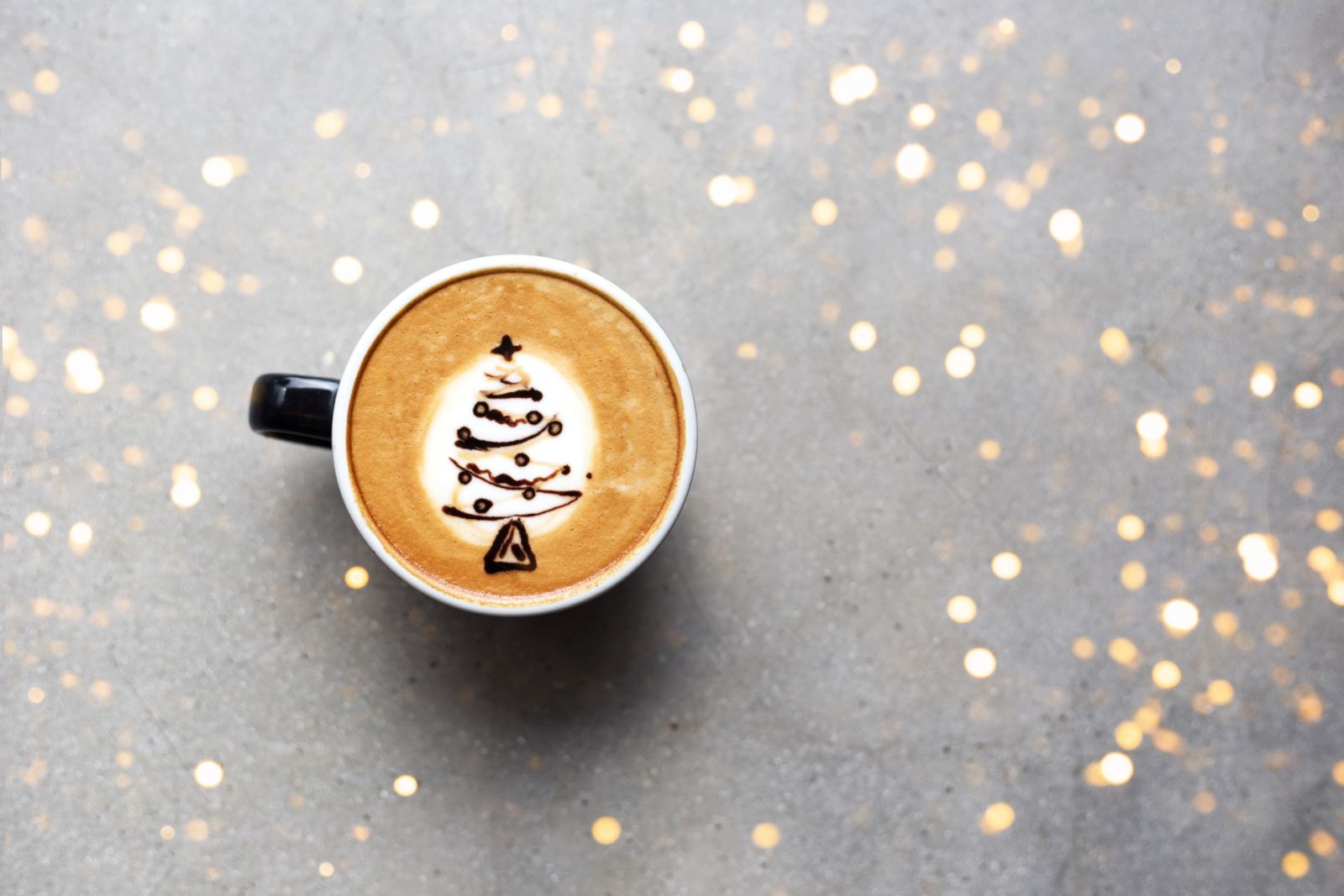 Image of a Holiday themed latte with a Christmas Tree Design