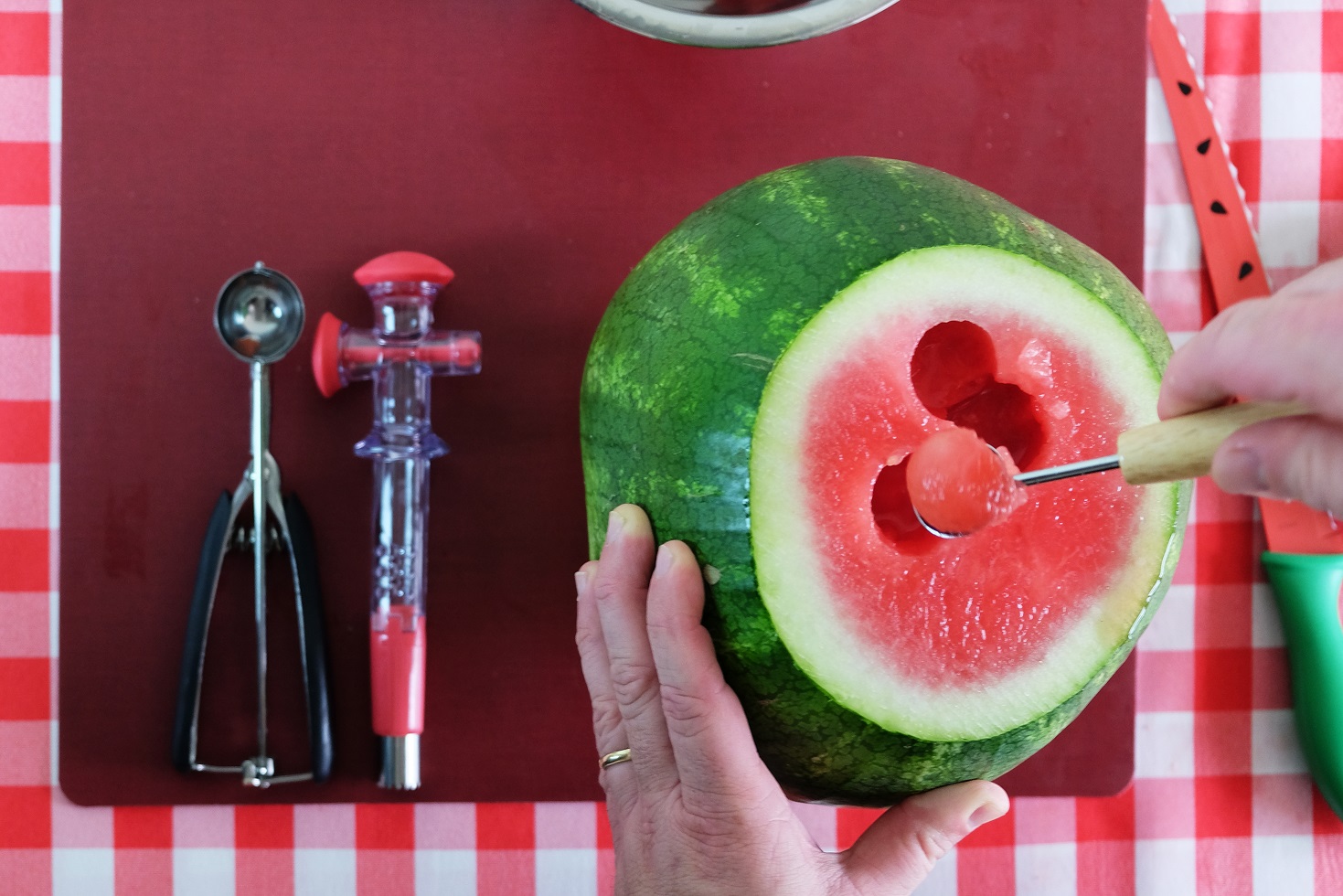 scooping out watermelon balls