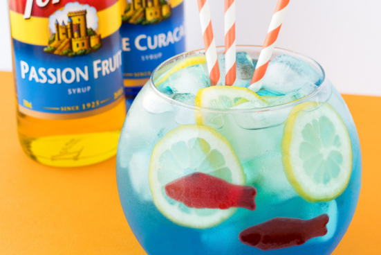 Blue Beverage with red fish gummies